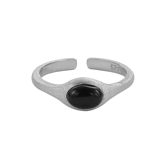 Silver textured ring with black oval stone