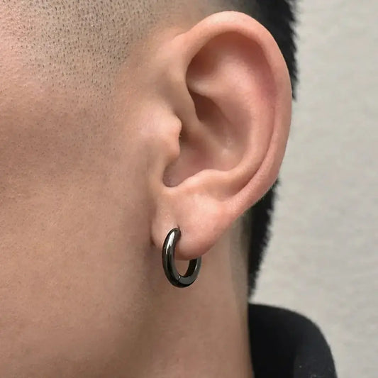 Black hoop earring with a shiny metallic finish