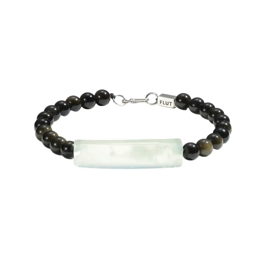 Flut bracelet with black beads and a white rectangular stone