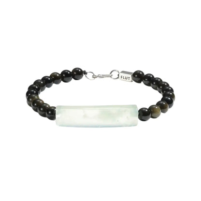 Flut bracelet with black beads and a white rectangular stone