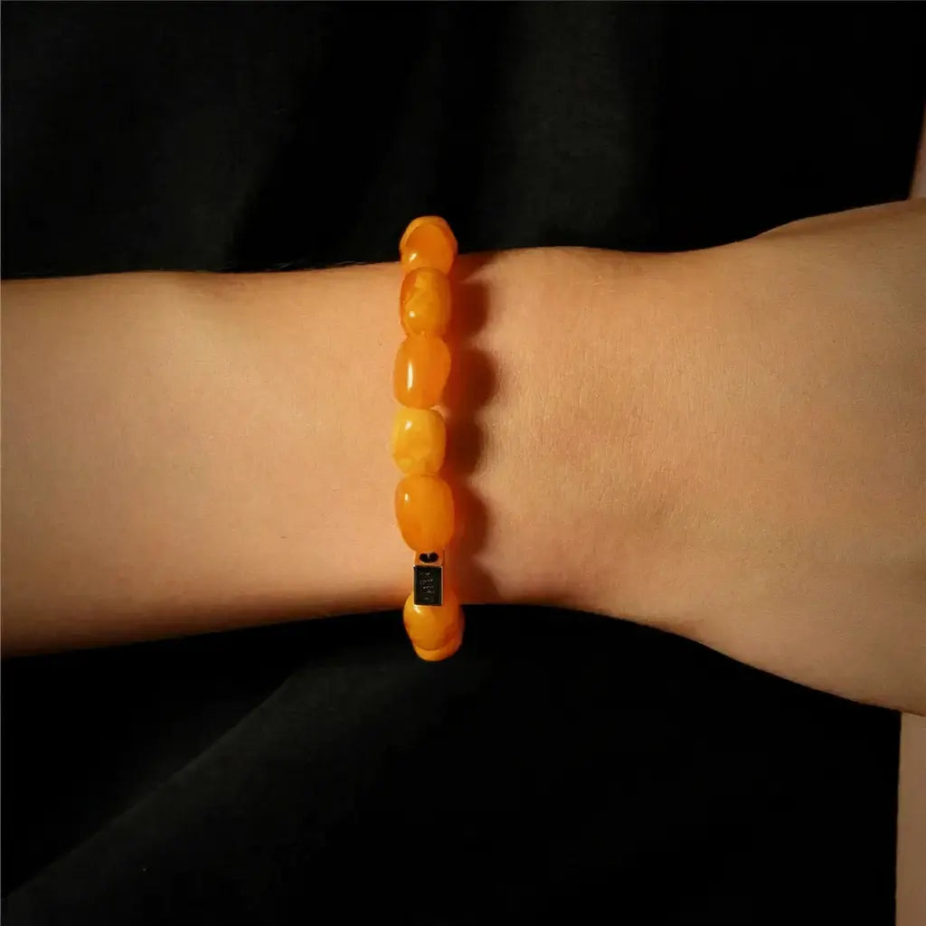 Orange beaded bracelet with black digital display