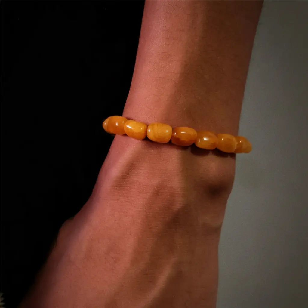 Amber bead bracelet with a smooth, polished finish