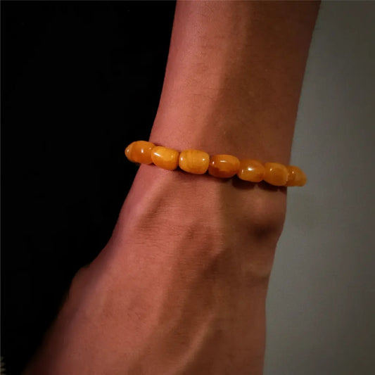 Amber bead bracelet with a smooth, polished finish