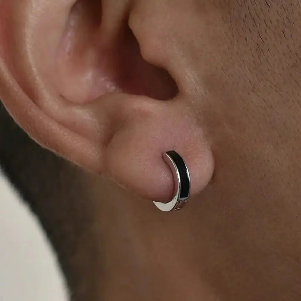 Silver hoop earring with black enamel inlay, minimalist design