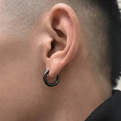 Black metal hoop earring with a matte finish and circular design