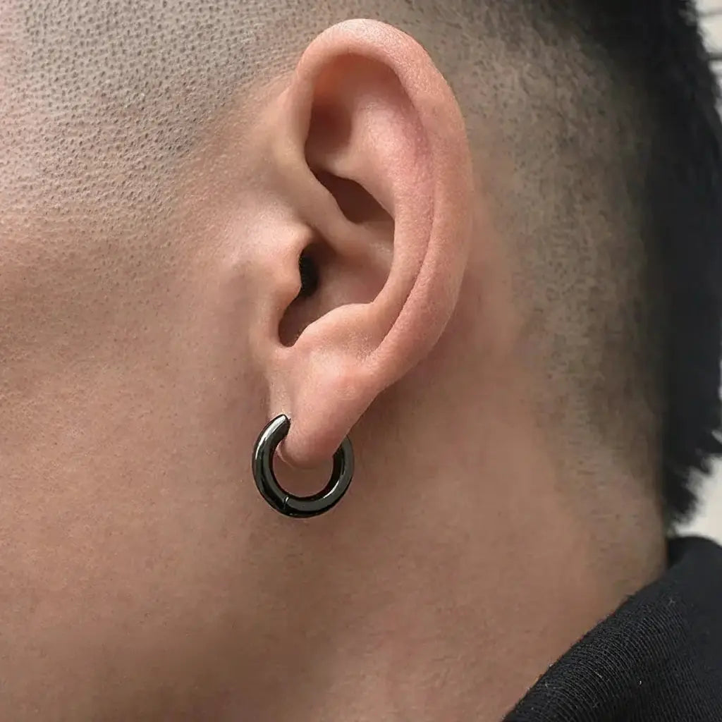 Black hoop earring with silver inner ring