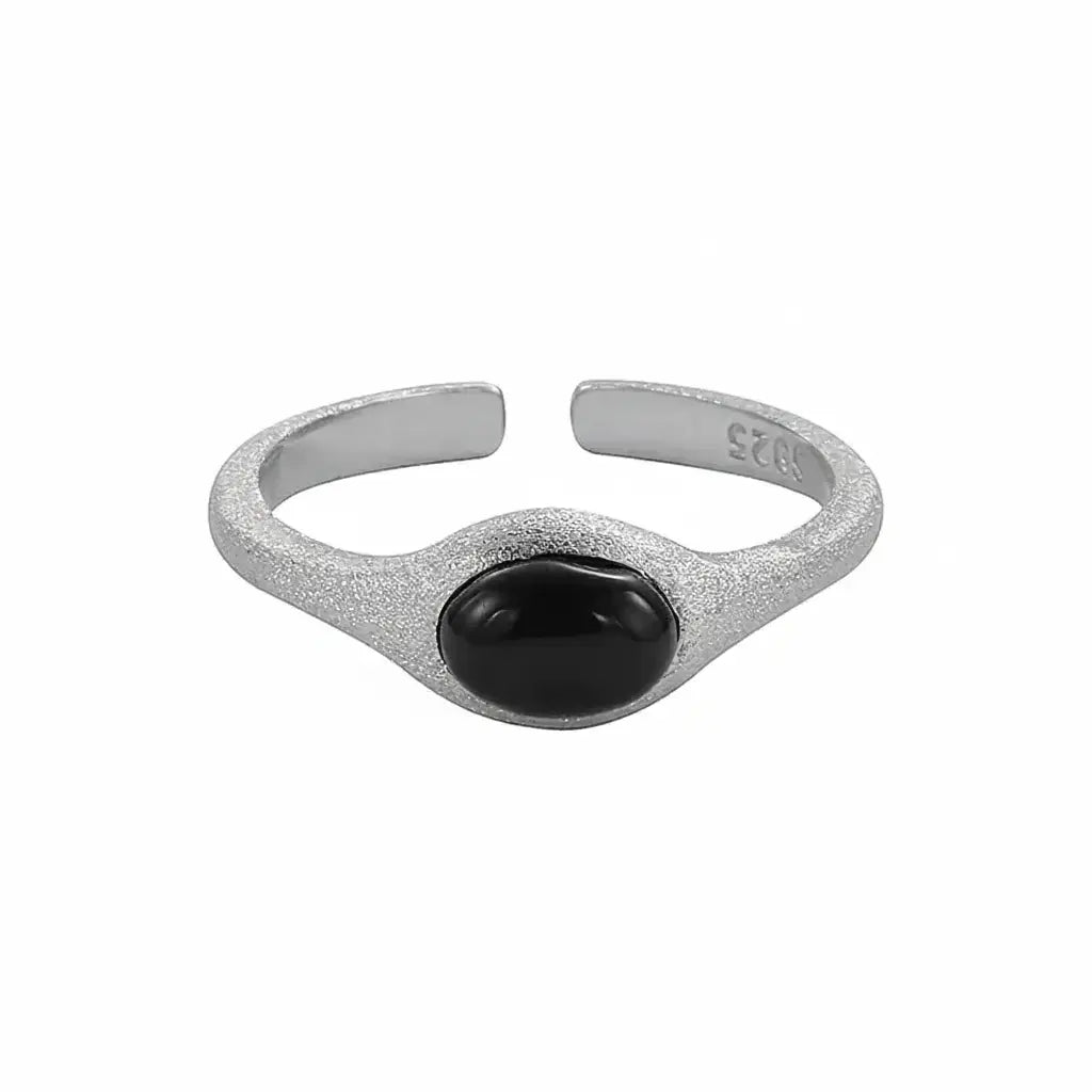 Silver textured ring with black oval stone