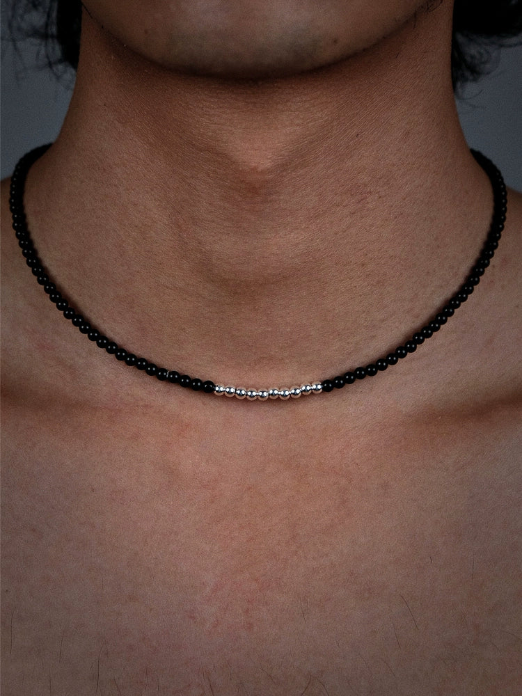 Black beaded necklace with silver accents and beads