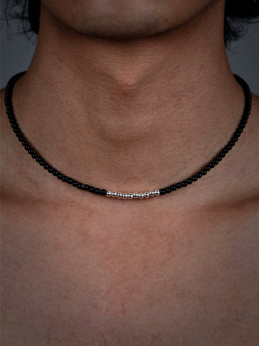 Black beaded necklace with silver accents and beads
