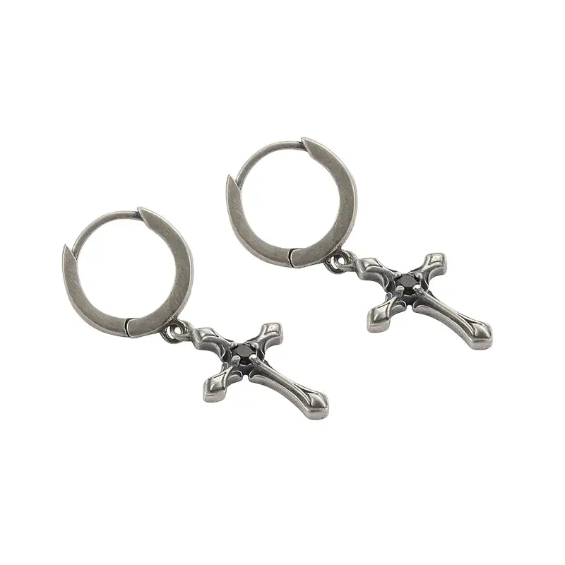 Silver cross hoop earrings with a polished finish and intricate design