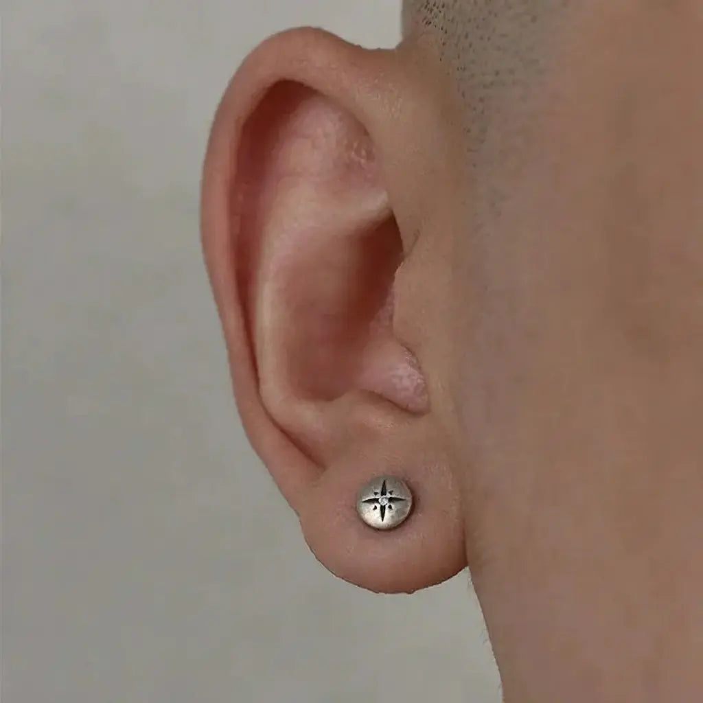 Silver star stud earring with a polished finish