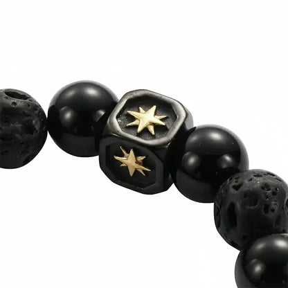 Black beaded bracelet with gold star accents and hexagonal centerpiece