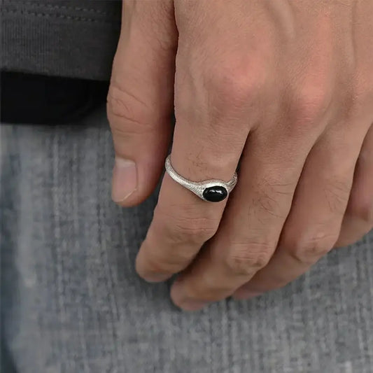 Silver skull ring with black stone eye detail