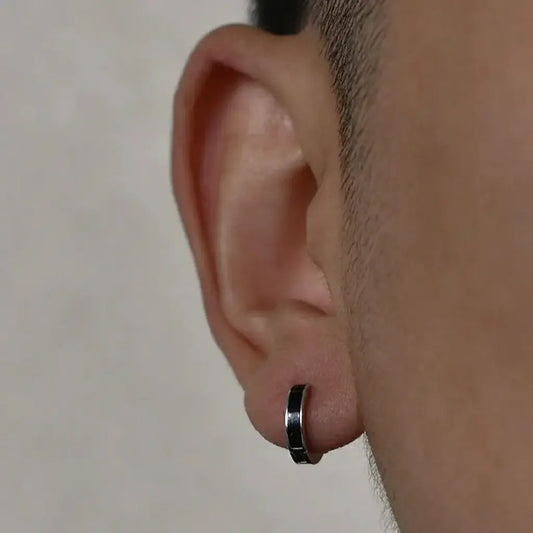 Silver and black ear cuff with a sleek, minimalist design
