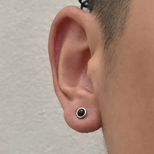 Black and silver stud earrings with a minimalist design