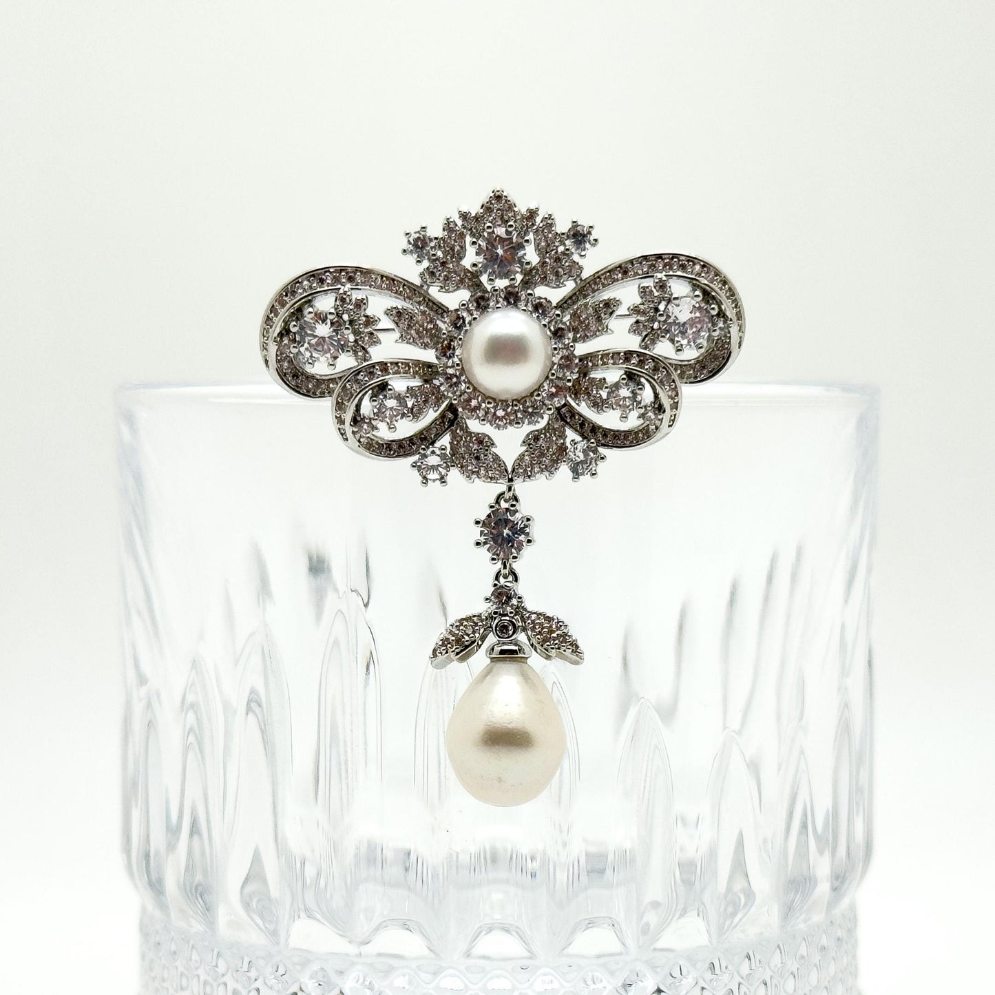 Vintage Rhinestone Bow Brooch with Dangling Pearl Pendant, Copper