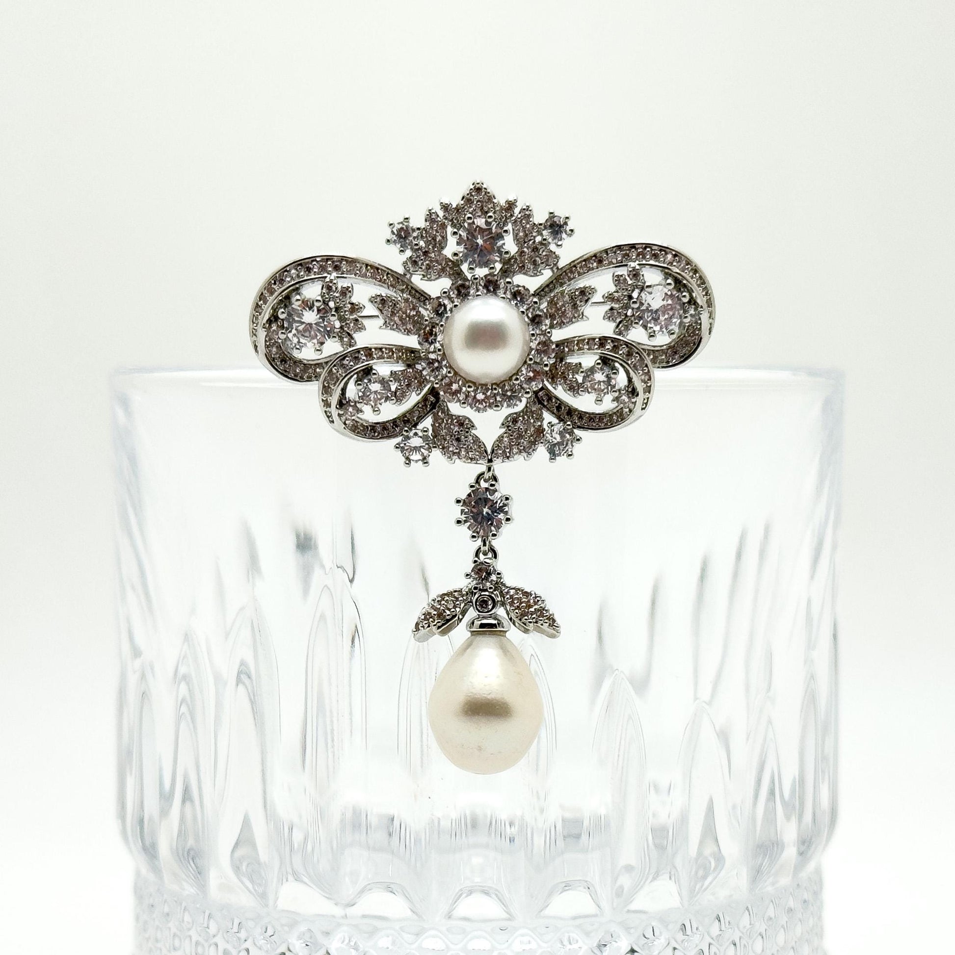 Vintage Rhinestone Bow Brooch with Dangling Pearl Pendant, Copper